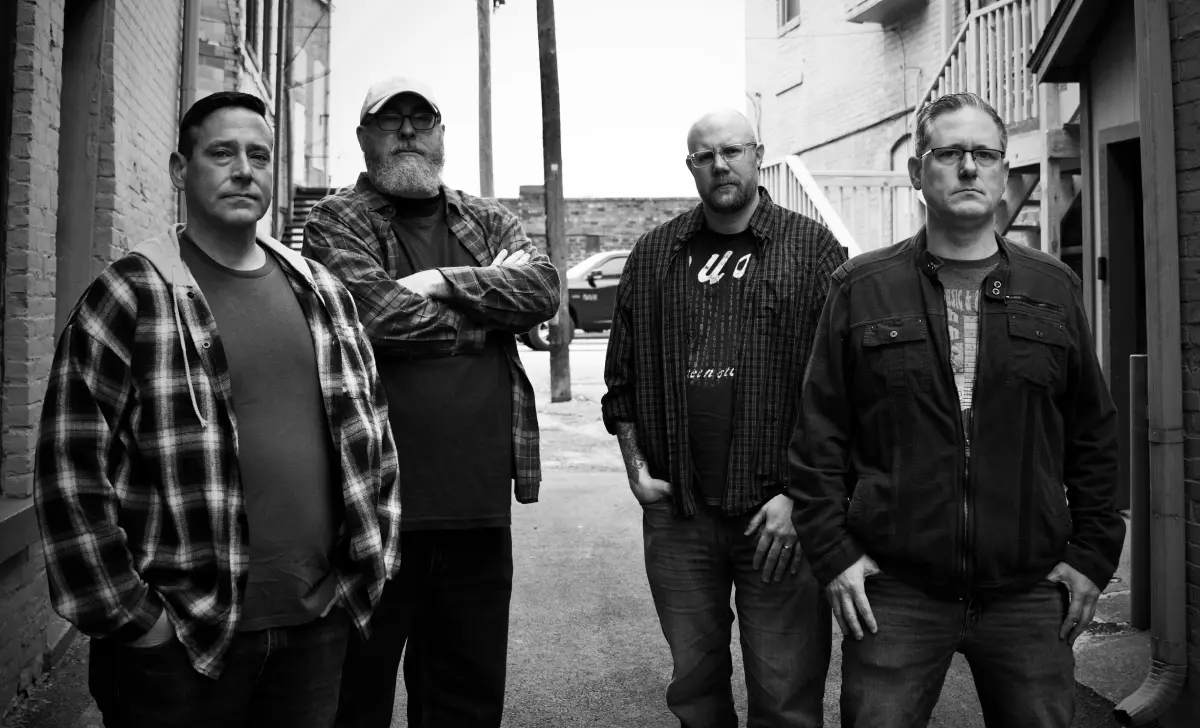 HouseShot Music standing in an alley